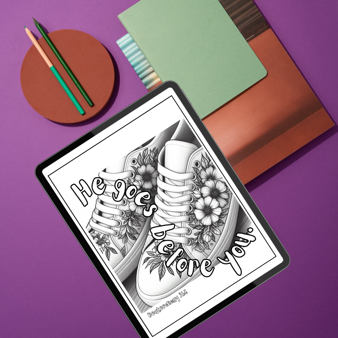 Coloring book page with a shoe design and text on a purple surface with coloring supplies.